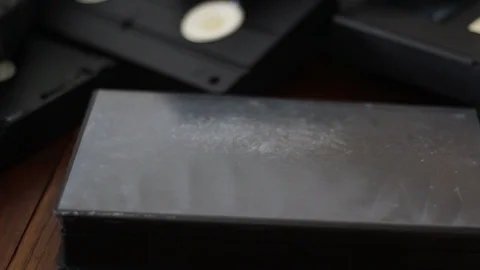 Put a vhs cassette tape in the box  Stock Footage 88335013