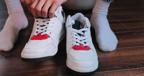 Put on the white snickers Stock Footage 135039255