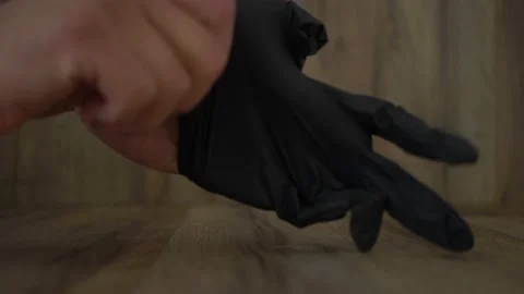 Put your black gloves on 4k Stock Footage 150811232