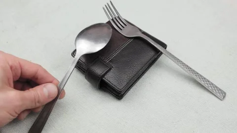 Put your fork and spoon on your wallet. The concept of rising food prices. Stock Footage 194955474