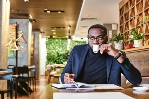 Put your thoughts in order. Portrait of a confident businessman making notes and Stock Photos