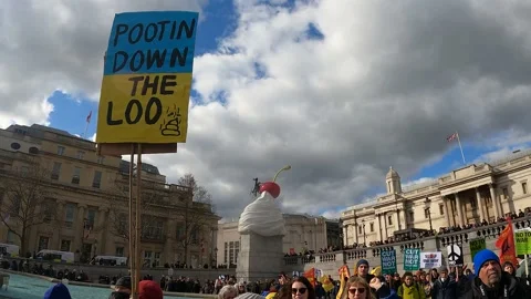 Putin down the loo no people creative sign London march support ukraine Video stock 171475519