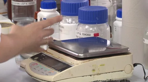 Puting bulb on the scales Stock Footage 45620499