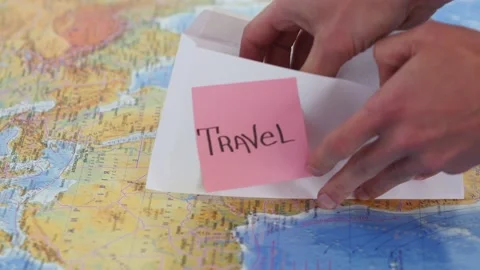 Puting dollar bills on the worls map Stock Footage 184473939