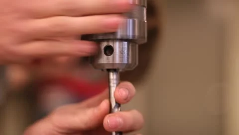 Puting drill bit in drill press Stock-Footage 10700369