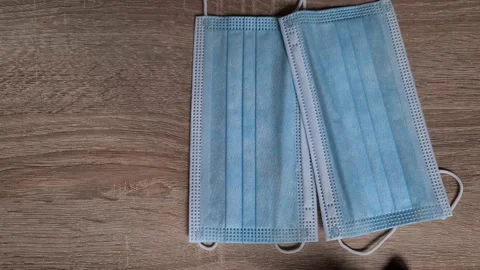 Puting the mask on the table. Stock Footage 156104618