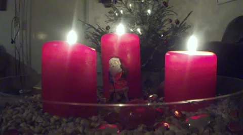Puting out red christmas candles Stock Footage 33698498