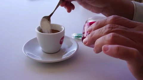 Puting sugar in Turkish coffee and stirring it. Stock Footage 321211559