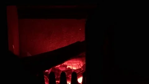 Puting wood in the fire place, heating Stock Footage 166924445