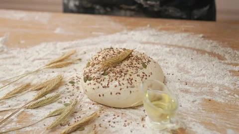 Puts An Ear Of Wheat On Raw Dough Stockbeeldmateriaal 273501072