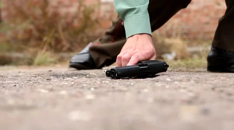 Puts the gun Stock Footage 62559426