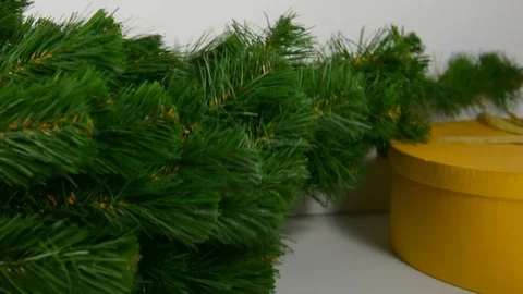 Puts a holiday tree on a white table Stock Footage 120695764