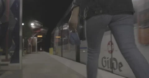 Puts on mask as train arrives Stock Footage 141480978