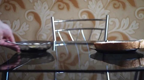 Puts a plate of dumplings on the table Stock Footage 35740832