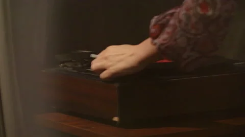 Puts a record on the gramophone Stock Footage 41211992