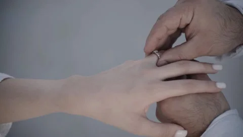 Puts on a ring Stock Footage 227164605