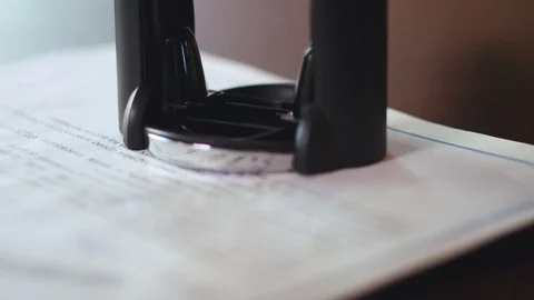 Puts a seal on the contract. Slow motion. Close up Stock Footage 74210299