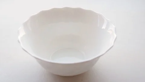 Puts a spoon ice cream in a white bowl Stock Footage 110892213