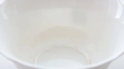 Puts a spoon ice cream in a white bowl Stock Footage 110892214