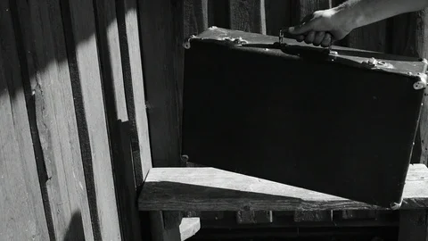 Puts the suitcase on the bench Stock Footage 110844608