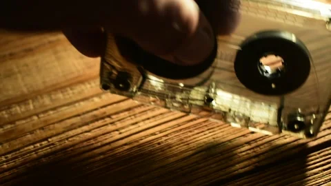 Puts the tape cassette on the table Stock Footage 135417195
