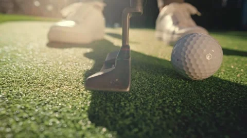 Putter Slow Motion Sun Flare Backyard Green White Sneakers Wide Angle Lifestyle Stock Footage 334474962
