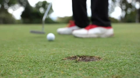 Putter stroke avoiding the hole Stock Footage 306622006