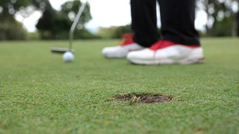 Putter stroke hitting the hole Stock Footage 306622004
