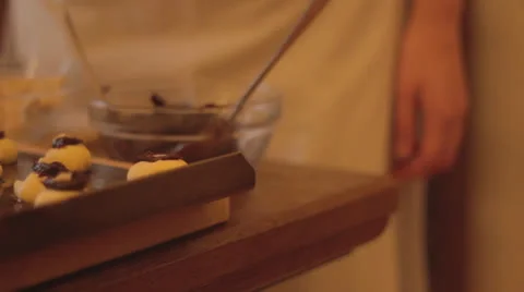 Putting almond on scones Video stock 23411215