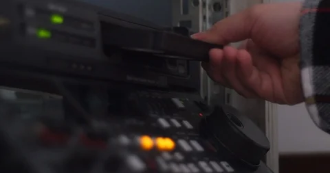 Putting and ejecting tape from linear video editing machine, power off Stock-Footage 126266748