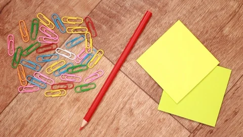 Putting and taking red pencil from stationery pile Stock Footage 99954821