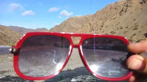 Putting On and Taking Off Sunglasses Stock Footage 12469318