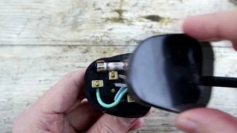 Putting The Back On A British Plug Stock-Footage 134729034