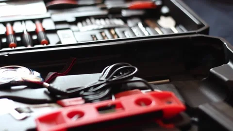 Putting back the drill machine in the tool box Stock Footage 242537695
