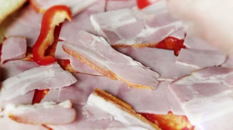 Putting bacon and bell pepper on pizza 스톡 동영상 8945150