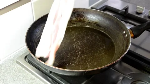 Putting Bacon in a Frying Pan Video stock 54110032