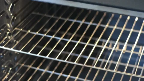 Putting the Baking Dish into the Oven Stock Footage 130357331