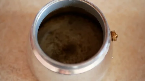 Putting basket containing ground coffee into the moka pot coffee maker. Stock Footage 70399987