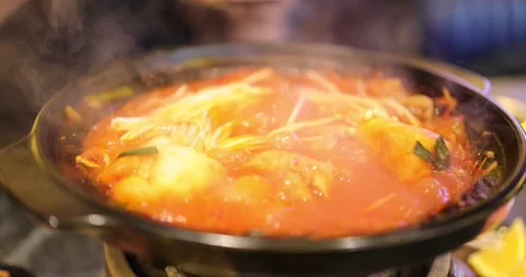 Putting Beef Strips in Beef Hotpot Stock Footage 263170043