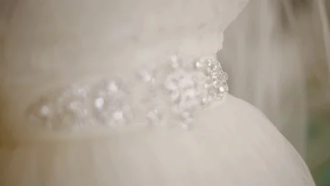 Putting a belt decorated with beads Stock Footage 73376587