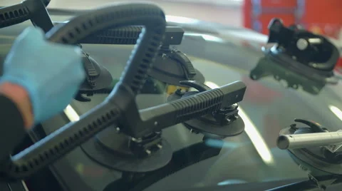 Putting a big panel on a front window to fix some cracks Stock Footage 59920969