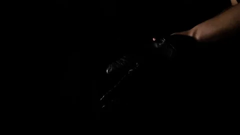 Putting on black gloves, good for murder Stock Footage 79667641