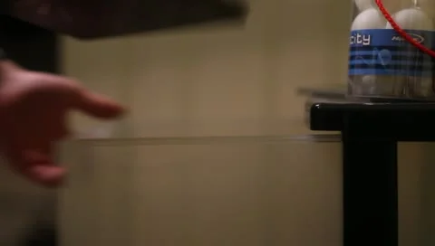 Putting Books in Drawer Video stock 10902888