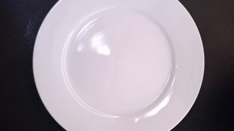 Putting braised beef ribs on plate overhead Stock Footage 120462372