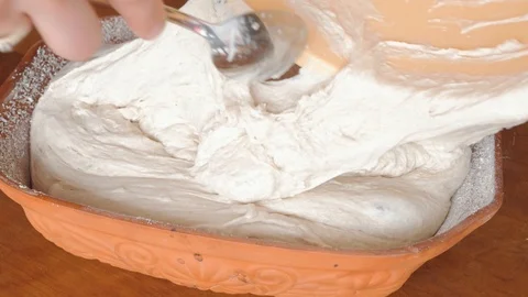 Putting bread dough into toman clay pot Stock Footage 87219652
