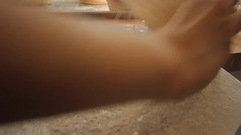 Putting bread dough on tray to put it in the oven Stock-Footage 130040284