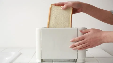 Putting a bread into the toaster Stock Footage 161809503
