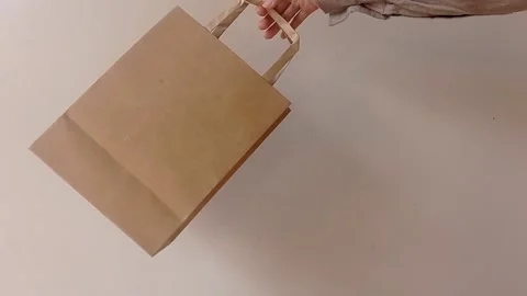 Putting brown clothe on a brown table Stock Footage 146255677