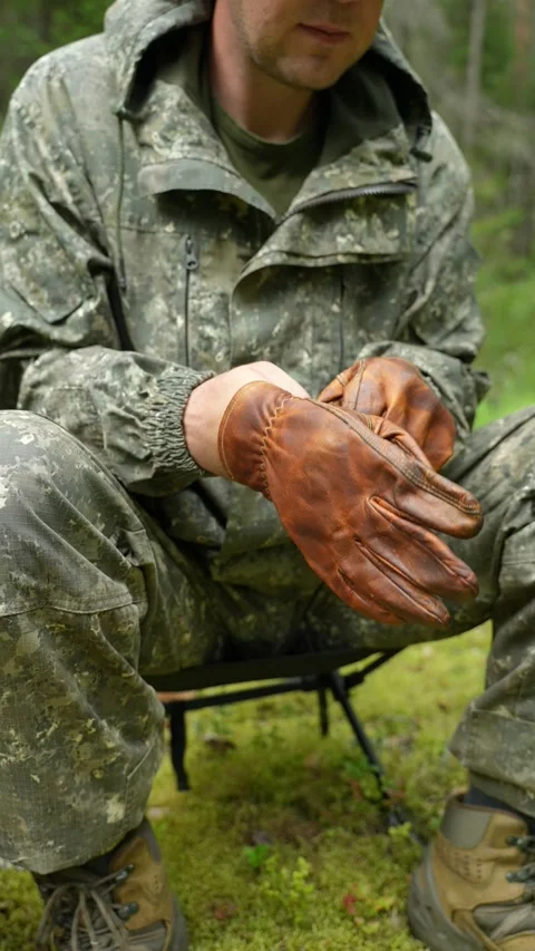 Putting on brown leather gloves Stock Footage 340653485
