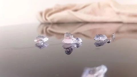 Putting brown pearls into a box Stock Footage 146255557